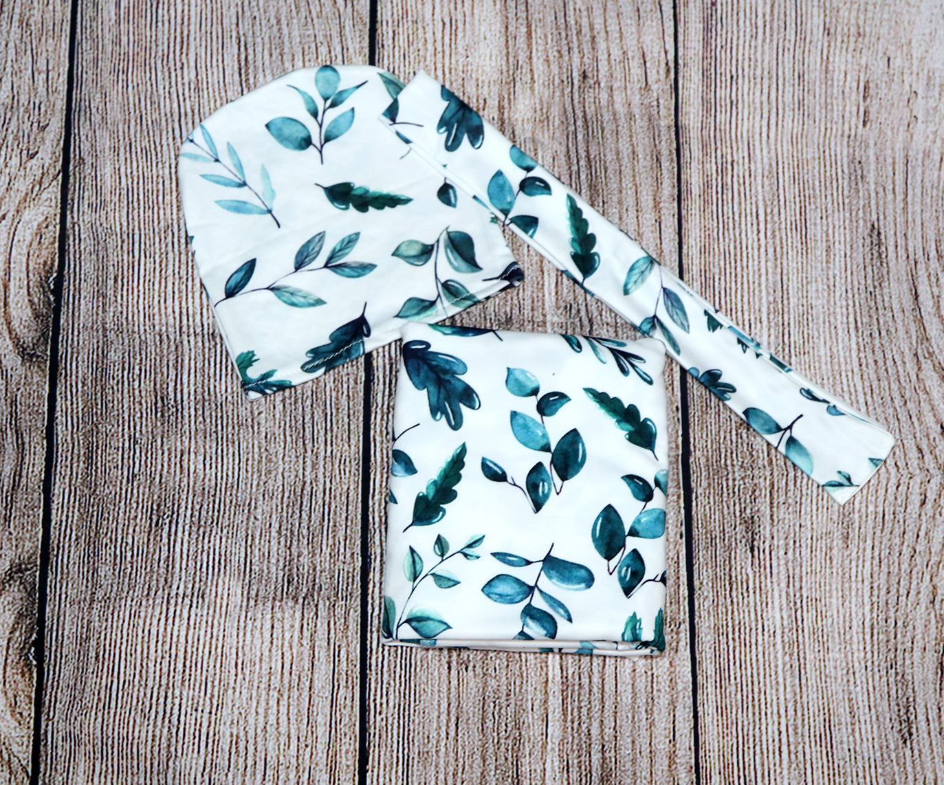 Green leaves baby swaddle with matching headband and hat